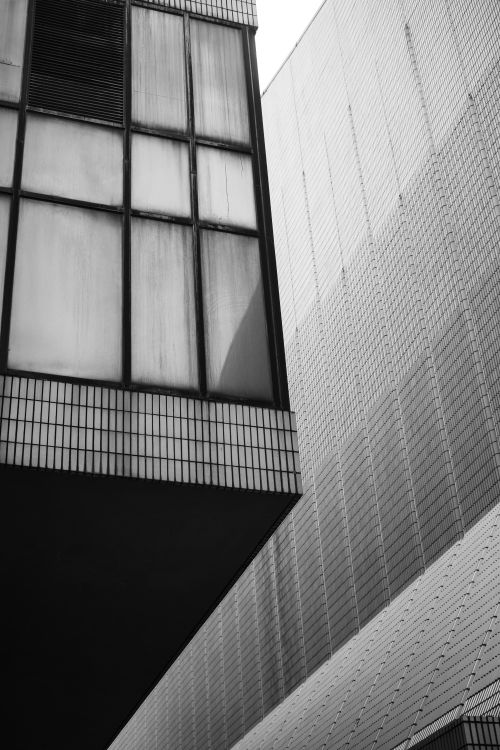 Free Black and white photo showcasing contemporary architecture in Kowloon, Hong Kong. Stock Photo