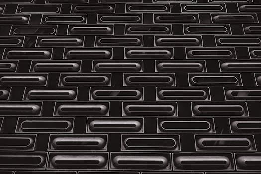 Monochrome wall pattern on Hong Kong Island, showcasing modern architectural design.