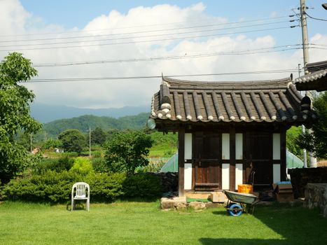 Charming traditional Korean house in a serene countryside setting, ideal for relaxing experiences.
