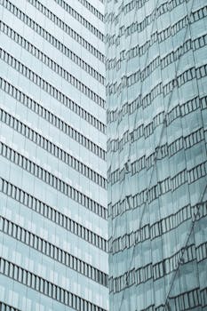 Abstract reflection of a modern glass skyscraper in urban Japan.