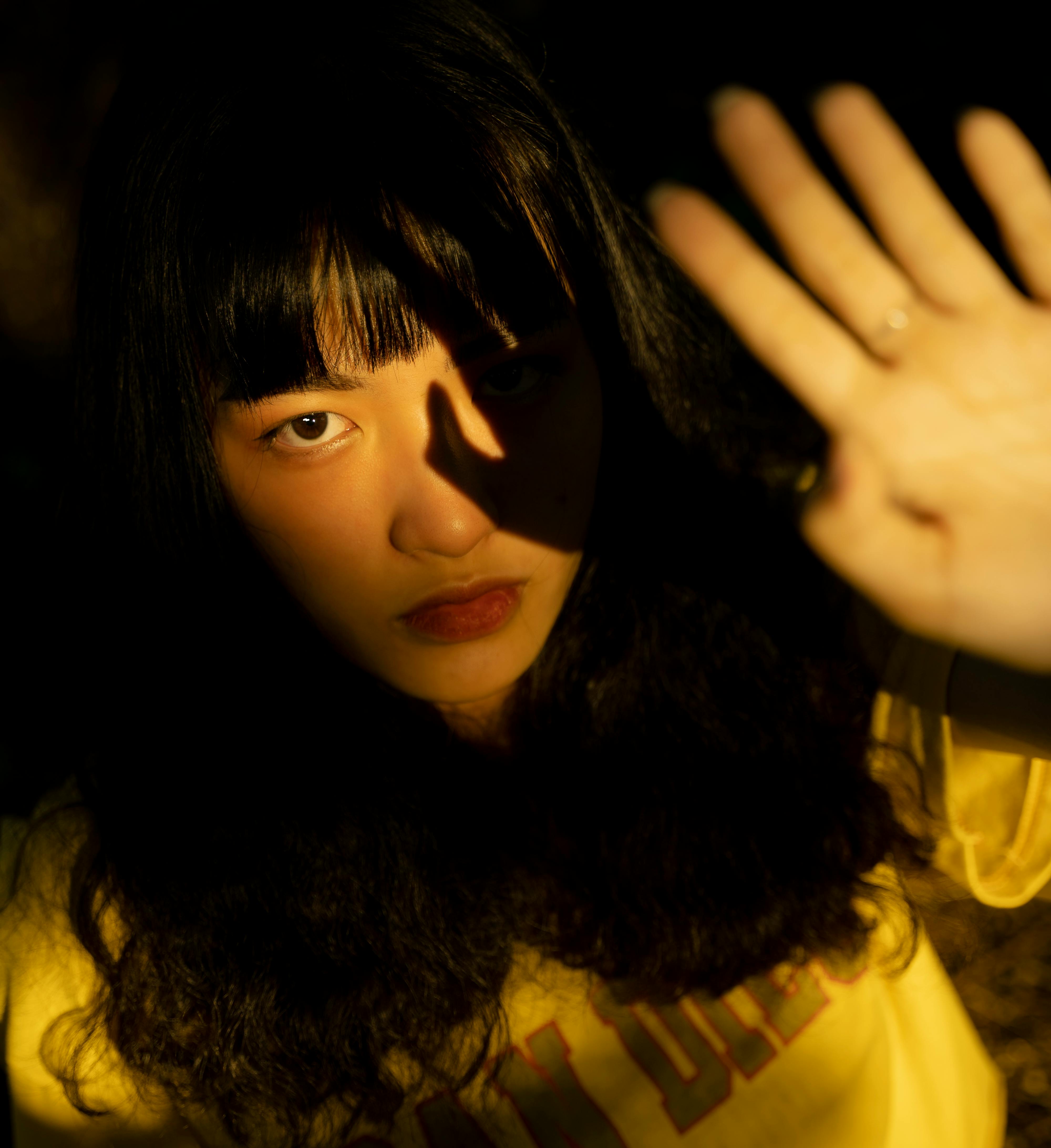 photo of woman wearing yellow shirt