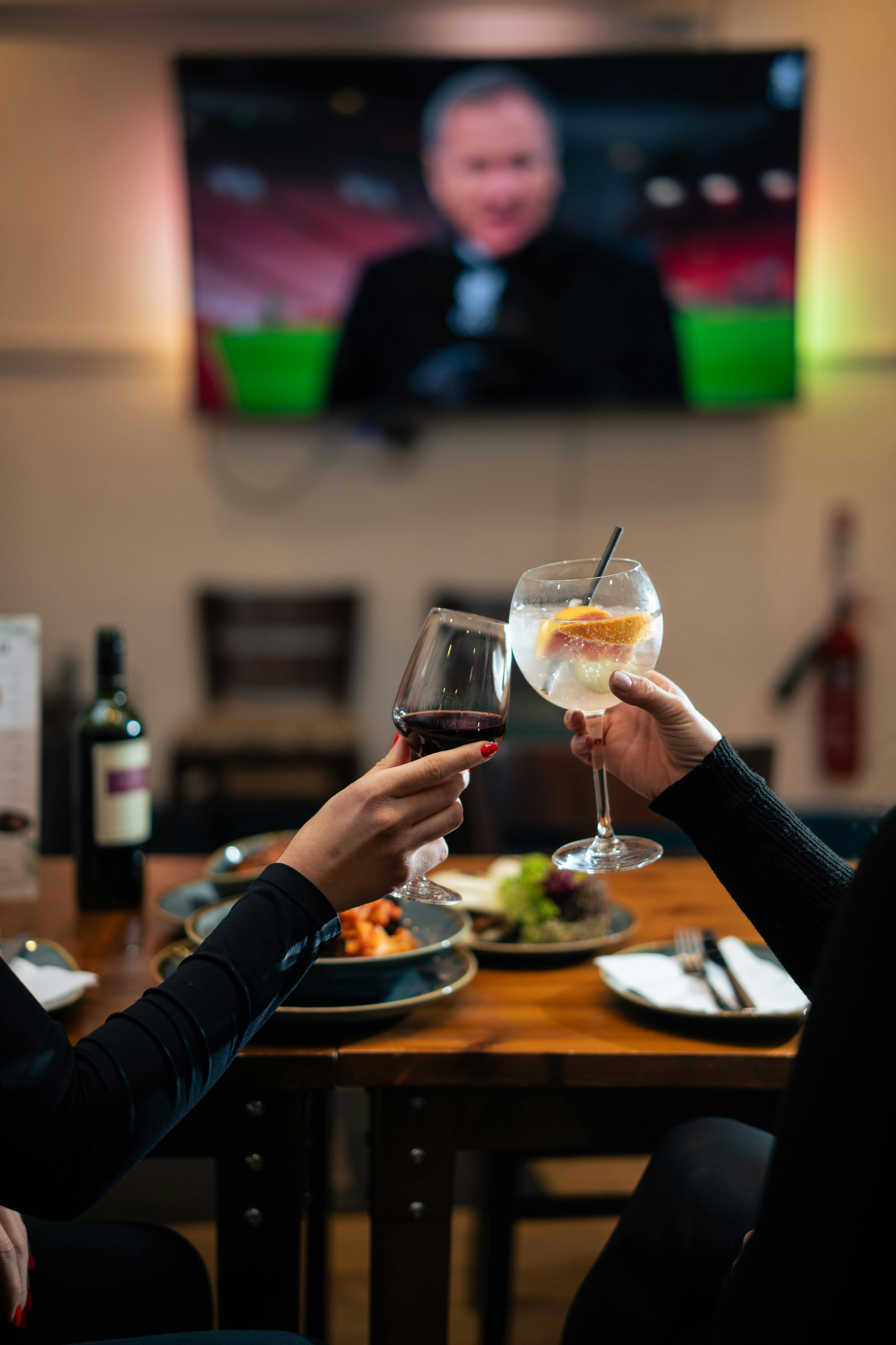 people toasting in a cozy restaurant setting
