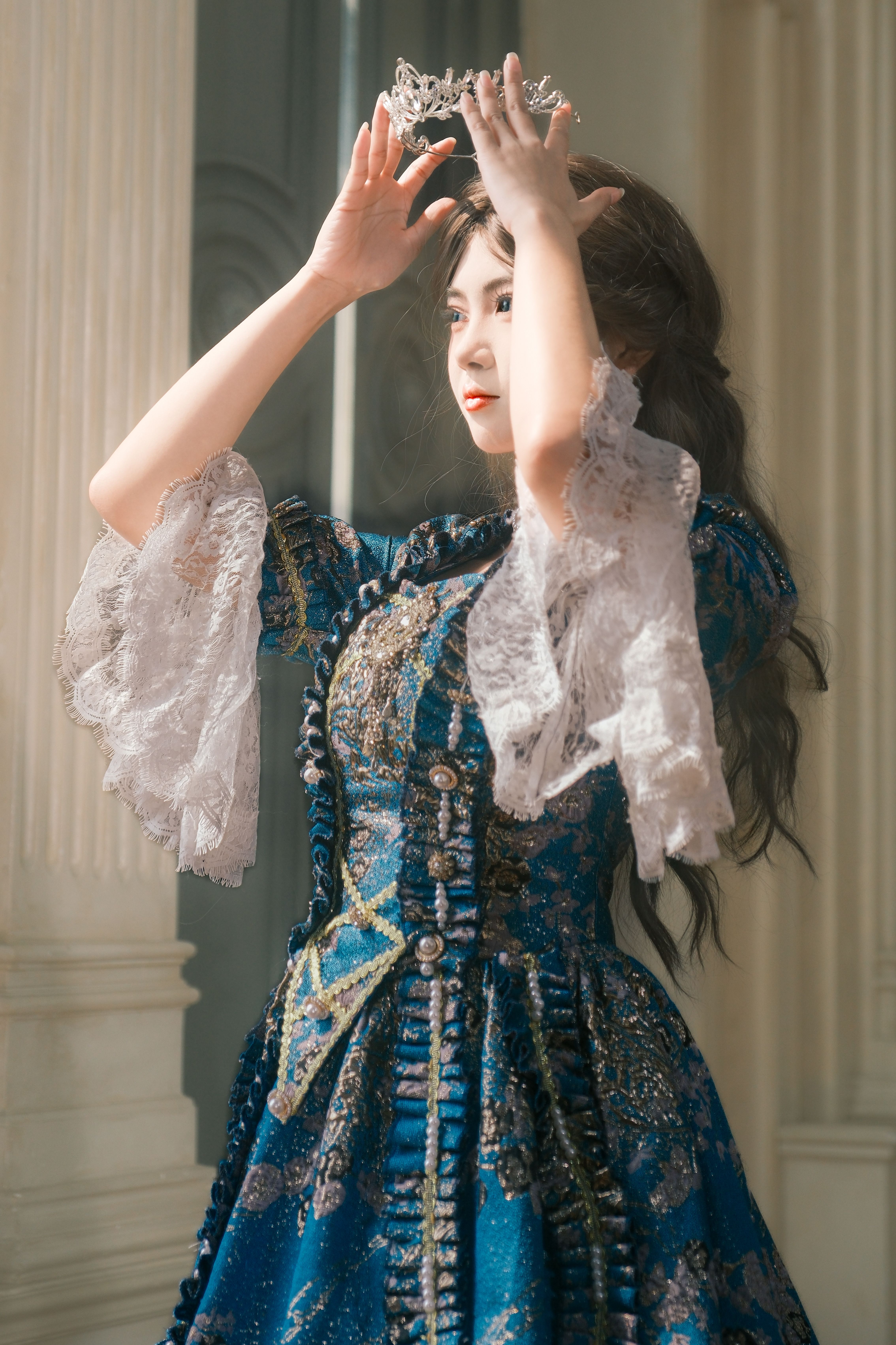 Elegant Woman in Royal Blue Historical Dress with Crown  Free Stock Photo