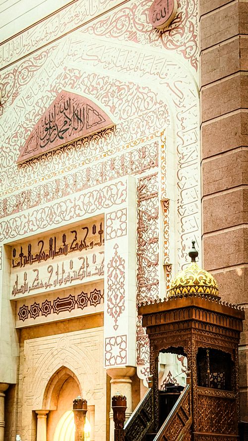 Free Detailed view of Islamic calligraphy and architectural elements in a Putrajaya mosque, Malaysia. Stock Photo