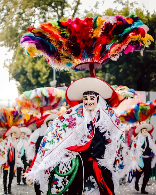 Free Colorful performance showcasing traditional Mexican dance with ornate costumes and feathered headdresses. Stock Photo