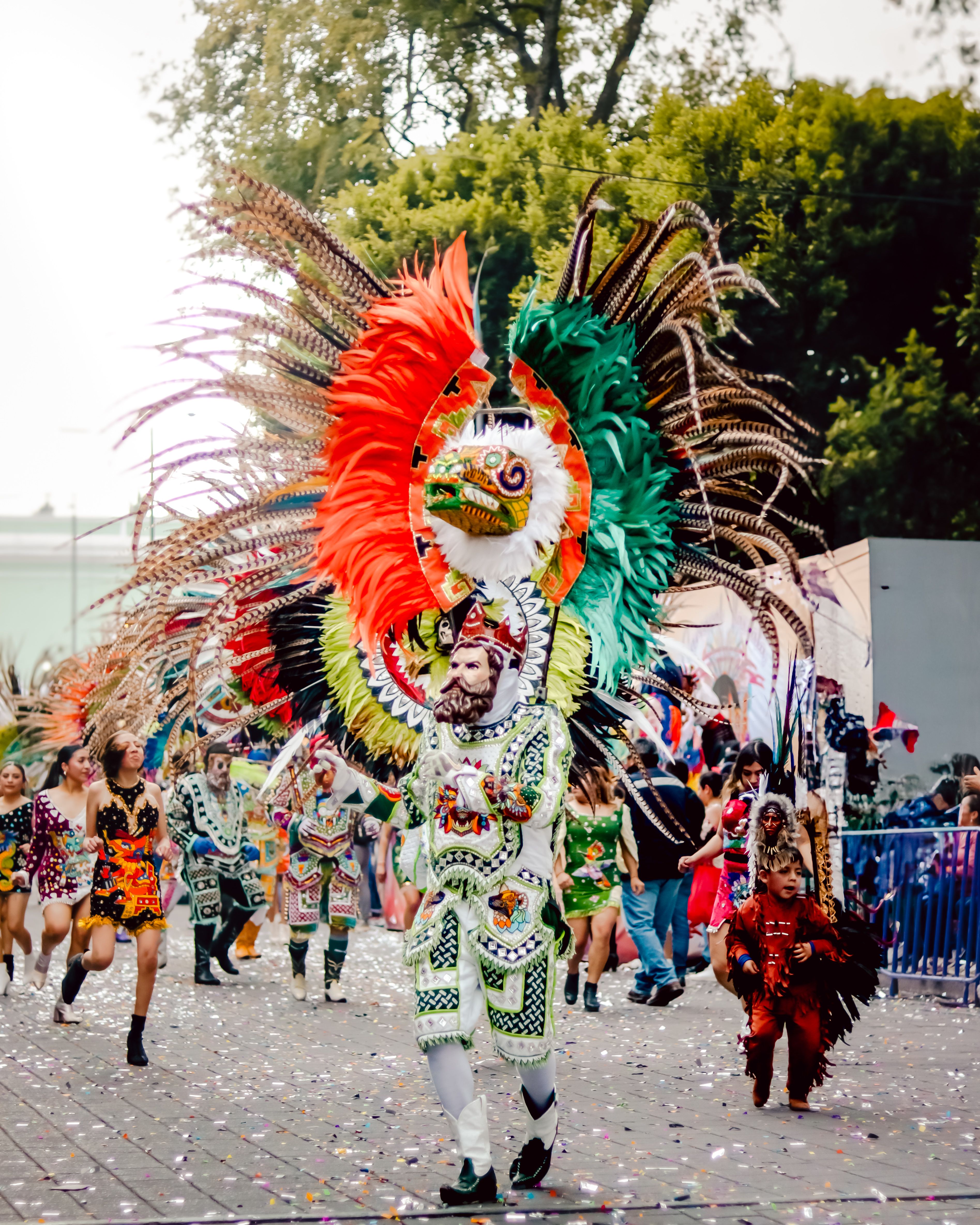 Vibrant Festival Parade with Traditional Costumes · Free Stock Photo