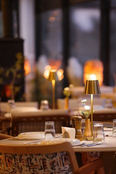 Elegant restaurant table setting with warm lighting, ideal for intimate dinners.