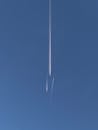 Jet Contrails Against Clear Blue Sky