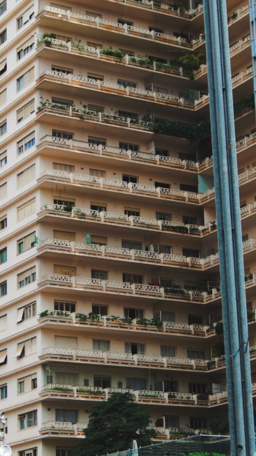 Free Exterior view of a classic apartment building in São Paulo, Brazil, highlighting its balconies and architecture. Stock Photo