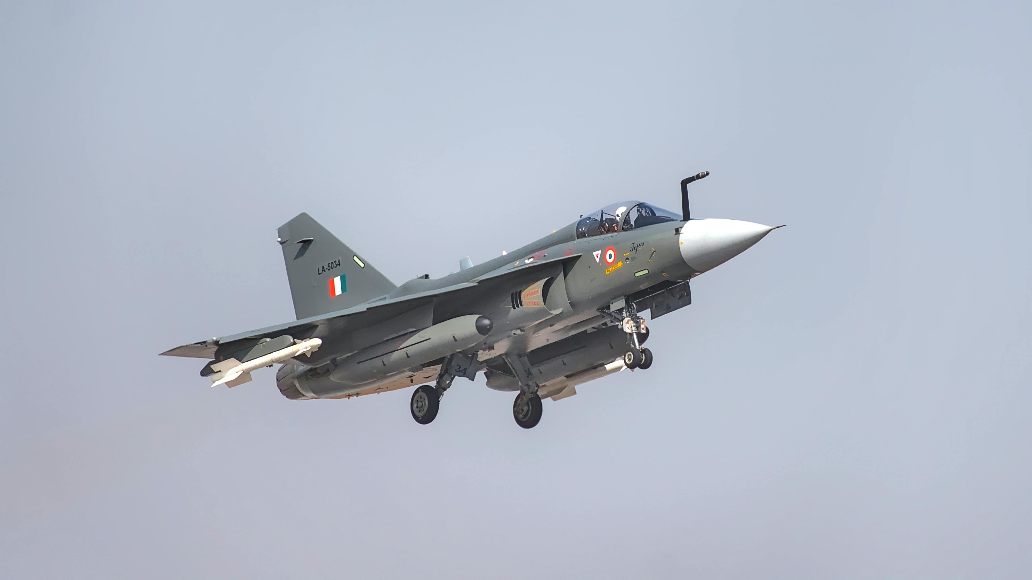 Indian Air Force fighter jet flying at Bengaluru air show, showcasing modern military aviation.