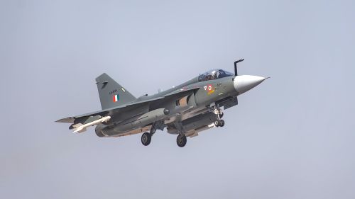 Free Indian Air Force fighter jet flying at Bengaluru air show, showcasing modern military aviation. Stock Photo