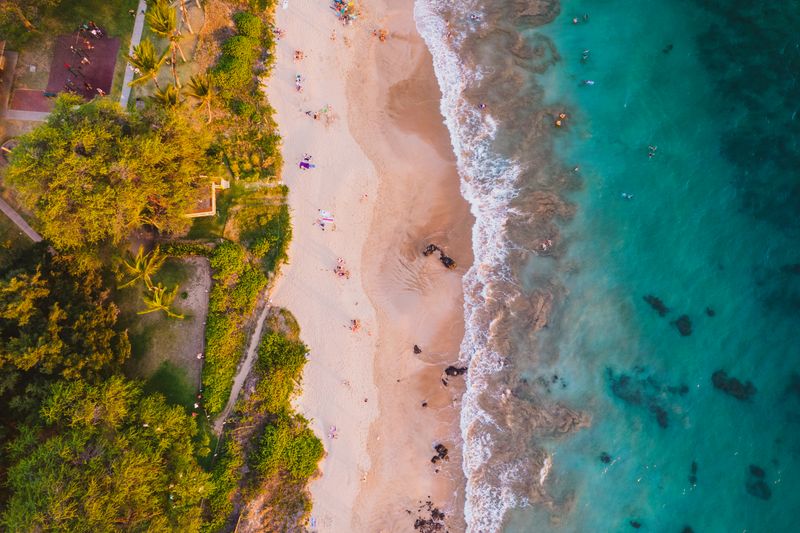 Aerial view of tropical beach with turquoise waters in Maui, Hawaii