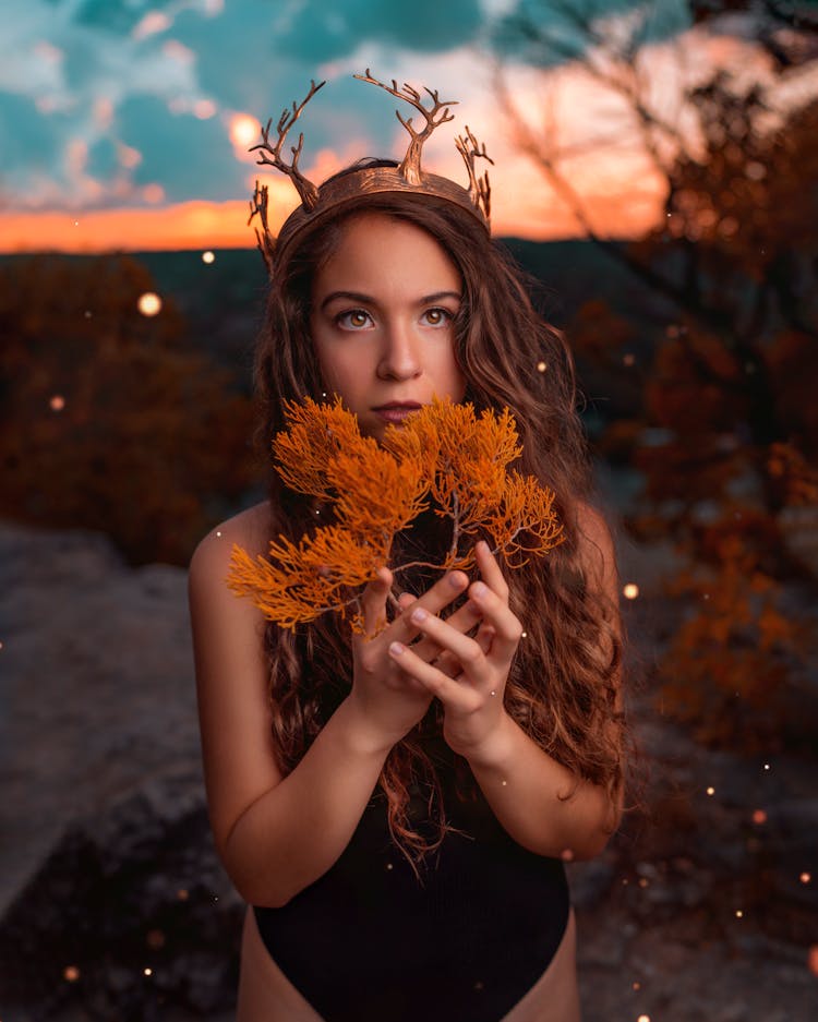 Woman Holding Leaves