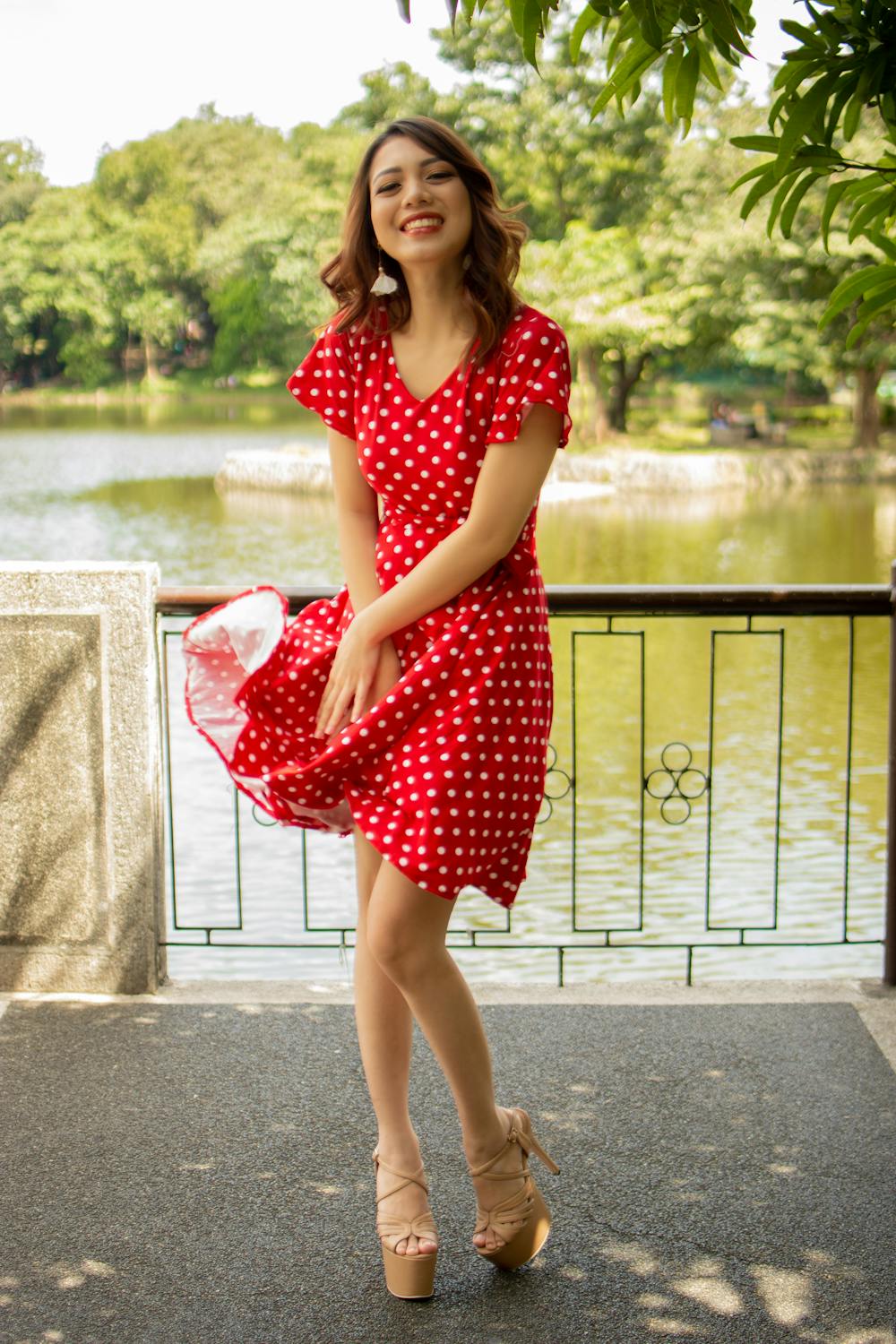 smiling-woman-in-red-and-white-polka-dot-dress-free-stock-photo