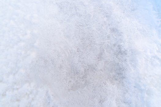 Detailed close-up of intricate ice crystals on a snowy surface in winter, Pärnu, Estonia.