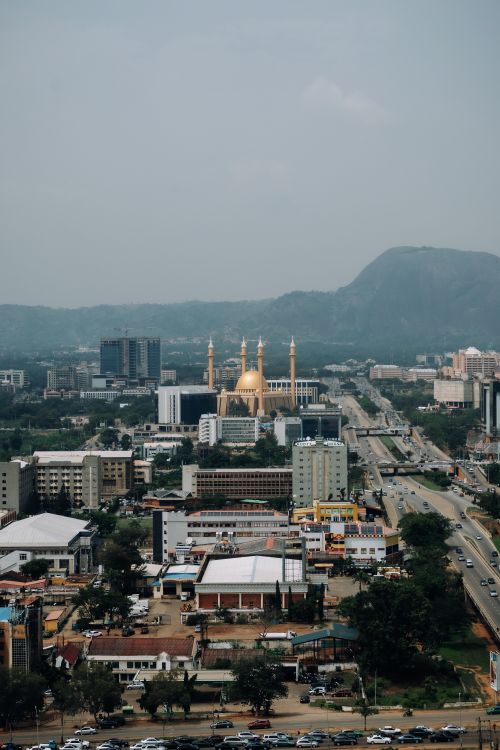 Free A breathtaking aerial view of Abuja highlighting the National Mosque with scenic cityscape. Stock Photo