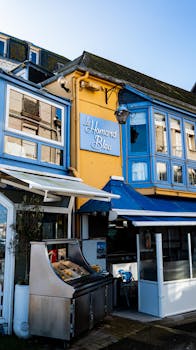 Exterior of Le Homard Bleu restaurant in Le Tréport, France, highlighting its vibrant façade.