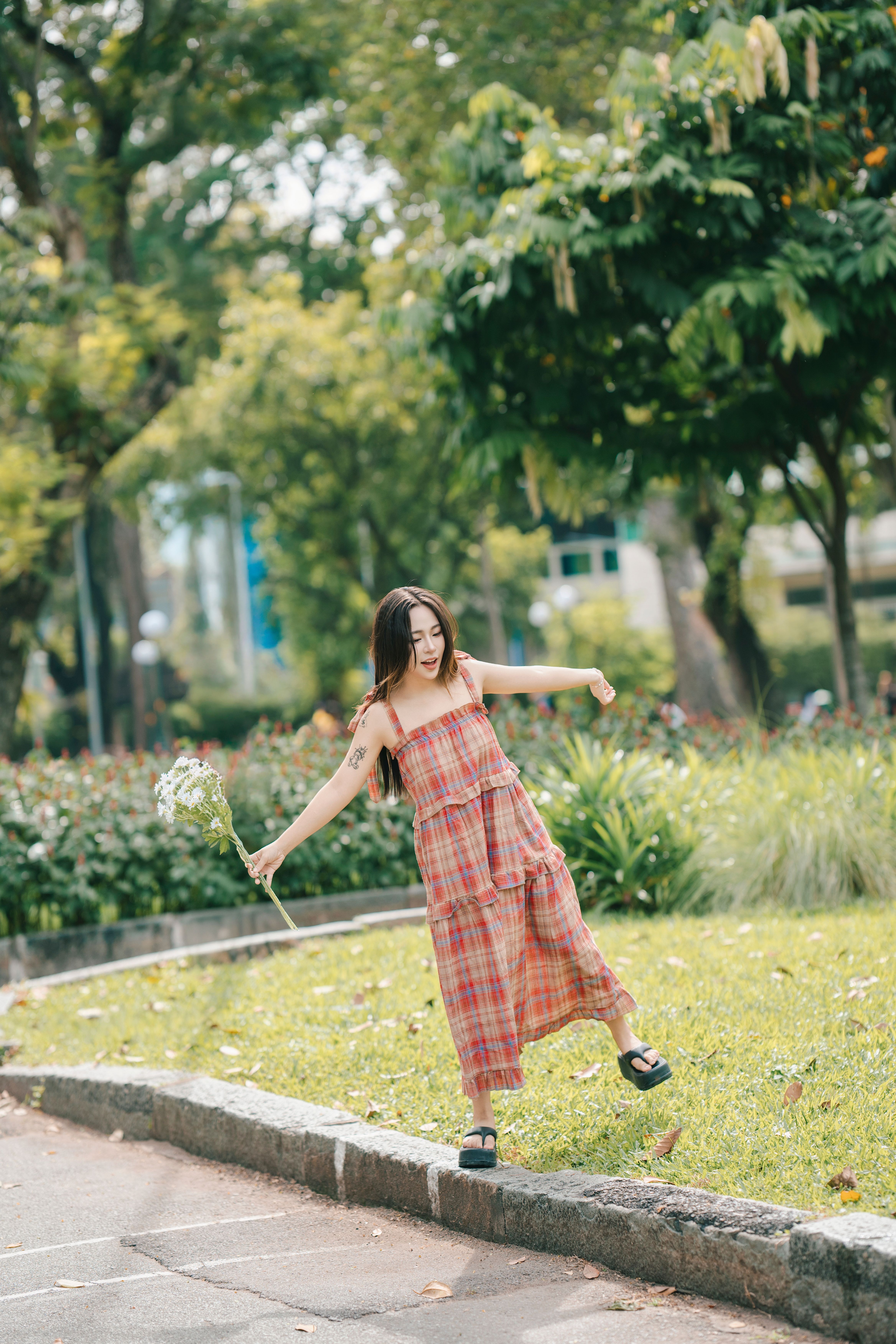 Young Woman Enjoying a Sunny Day in the Park · Free Stock Photo