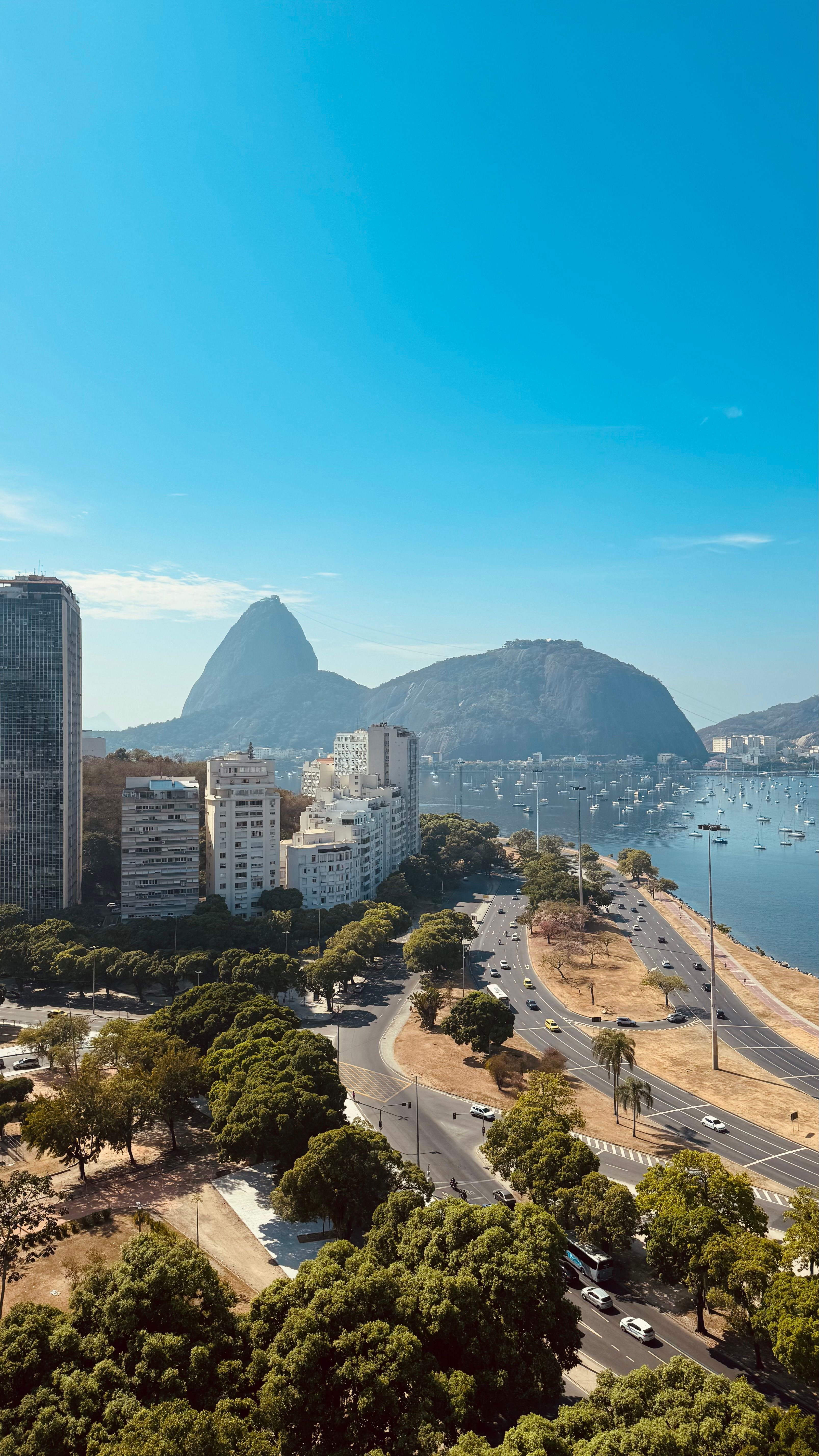Aerial view of Rio de Janeiro with Sugarloaf Mountain and coastline on a clear day — the kind of everyday tourist scene that defines travel to Brazil in 2026.