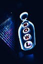 Vibrant Neon Bowling Sign in Urban Night Scene