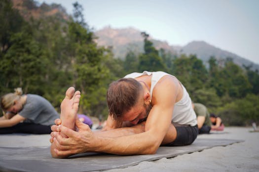 Group practicing yoga outdoors in lush Bali setting, promoting wellness and relaxation.