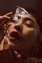 Close-up Photo of Woman Posing With Cling Wrap on Her Face
