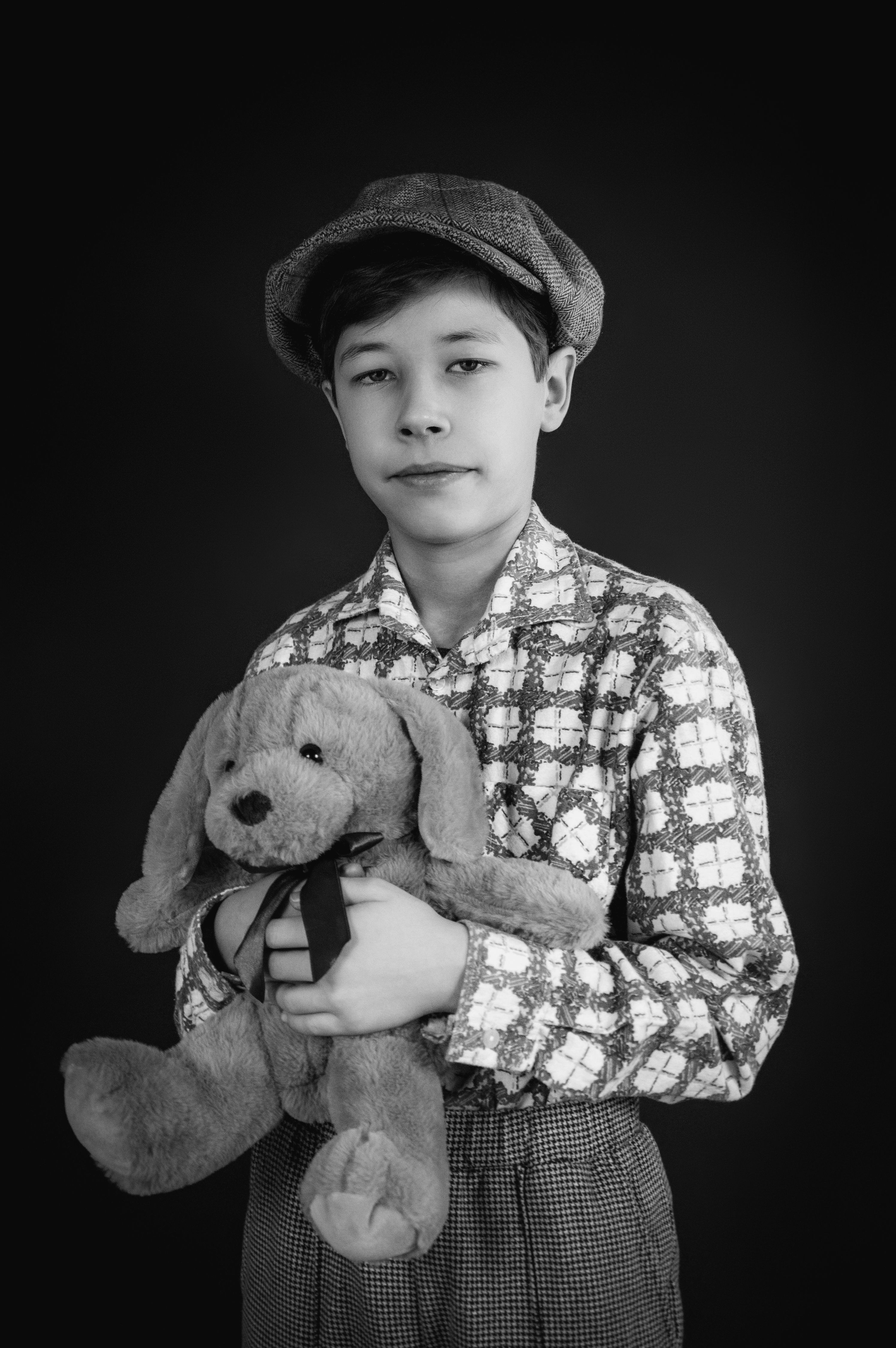 Vintage Style Boy Holding Teddy Bear Portrait · Free Stock Photo
