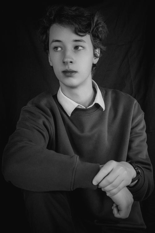 Free Sophisticated black and white portrait of a young adult in contemplative pose. Stock Photo