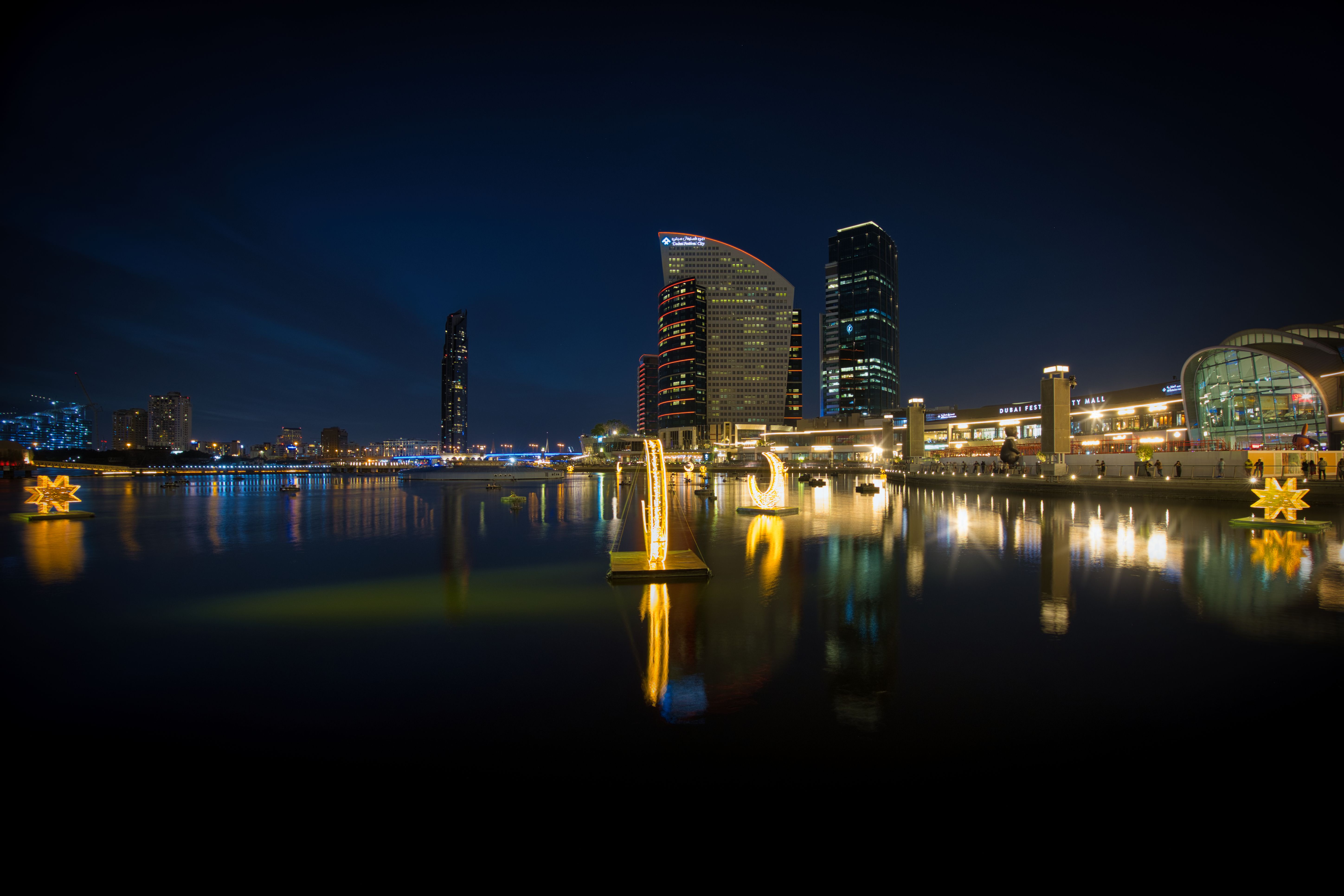Night View of Illuminated City Skyline Reflection · Free Stock Photo