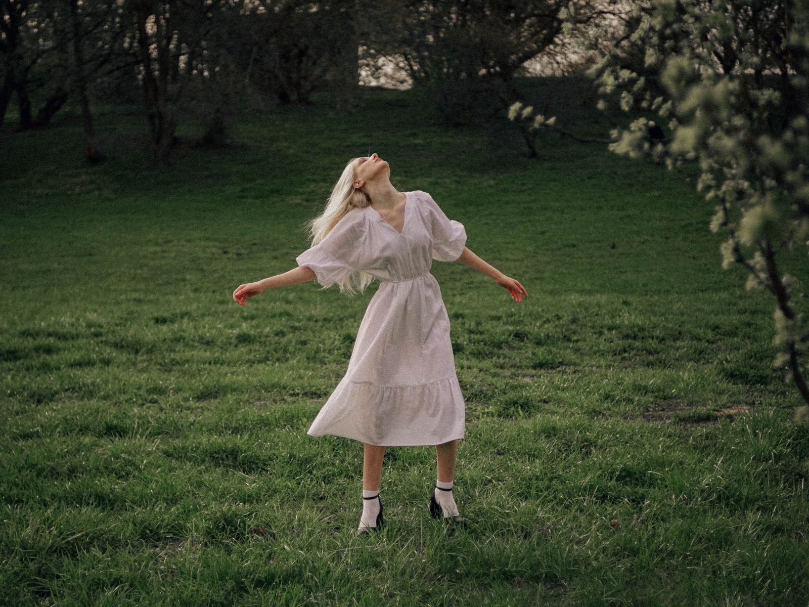 A young woman embracing nature in springtime