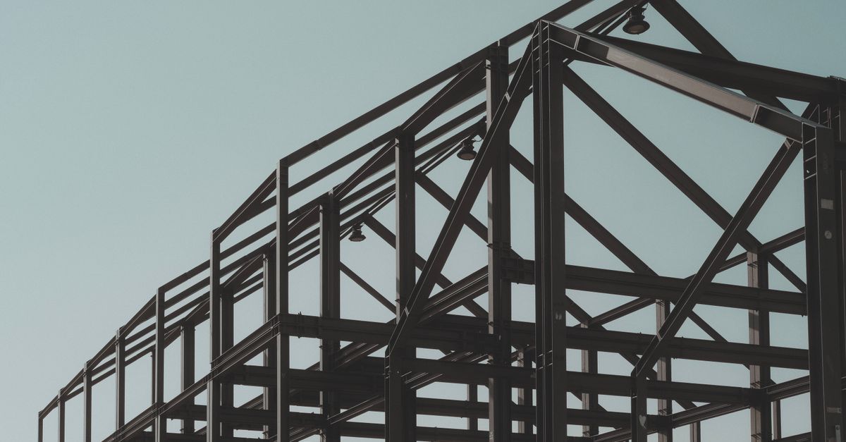 Structural Steel Frame Against Clear Sky ยท Free Stock Photo