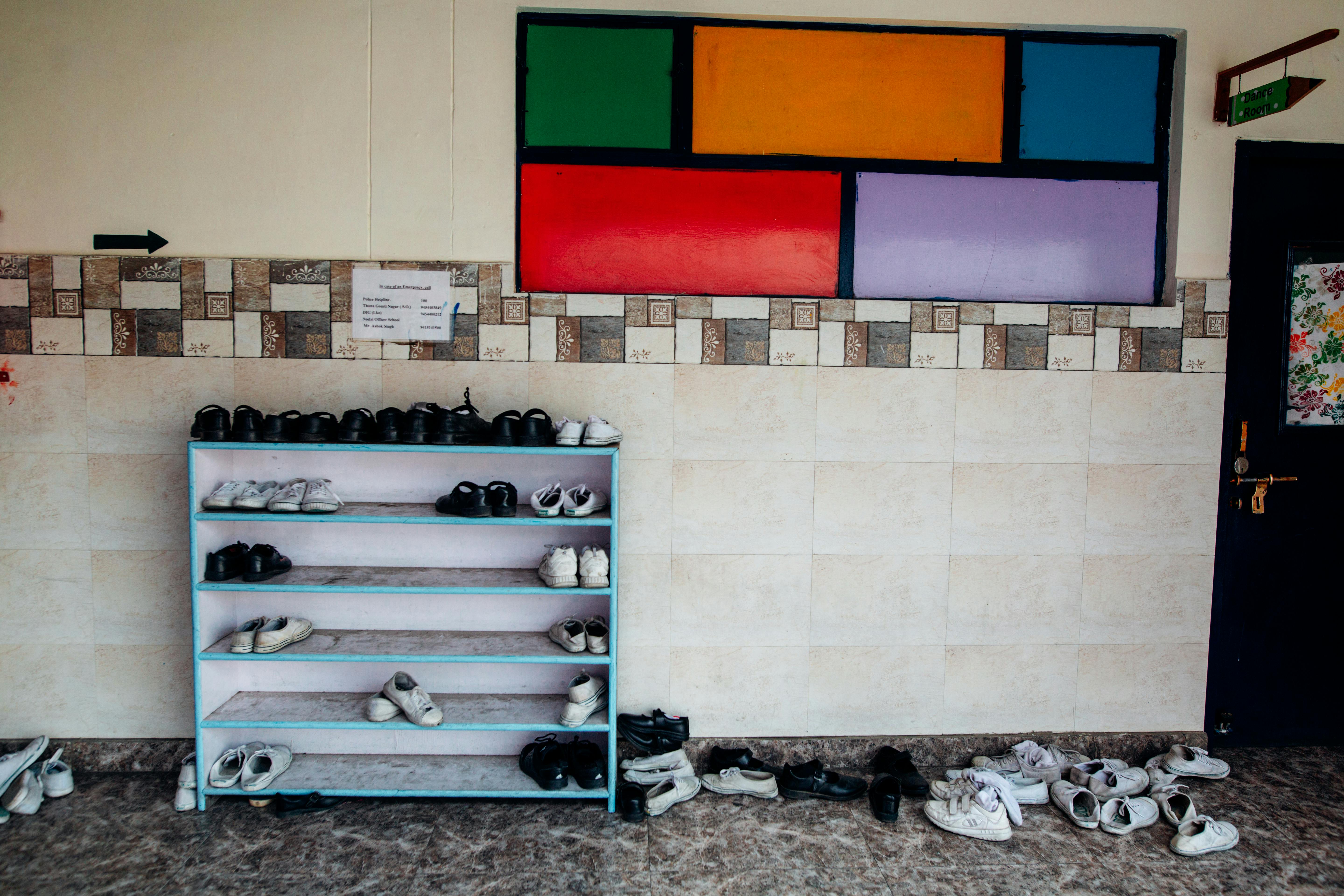 Teal Wooden Layered Shoe Rack Free Stock Photo