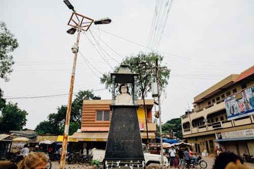 Statue Near Buildings