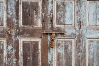 Old Wooden Door With Rusty Padlock