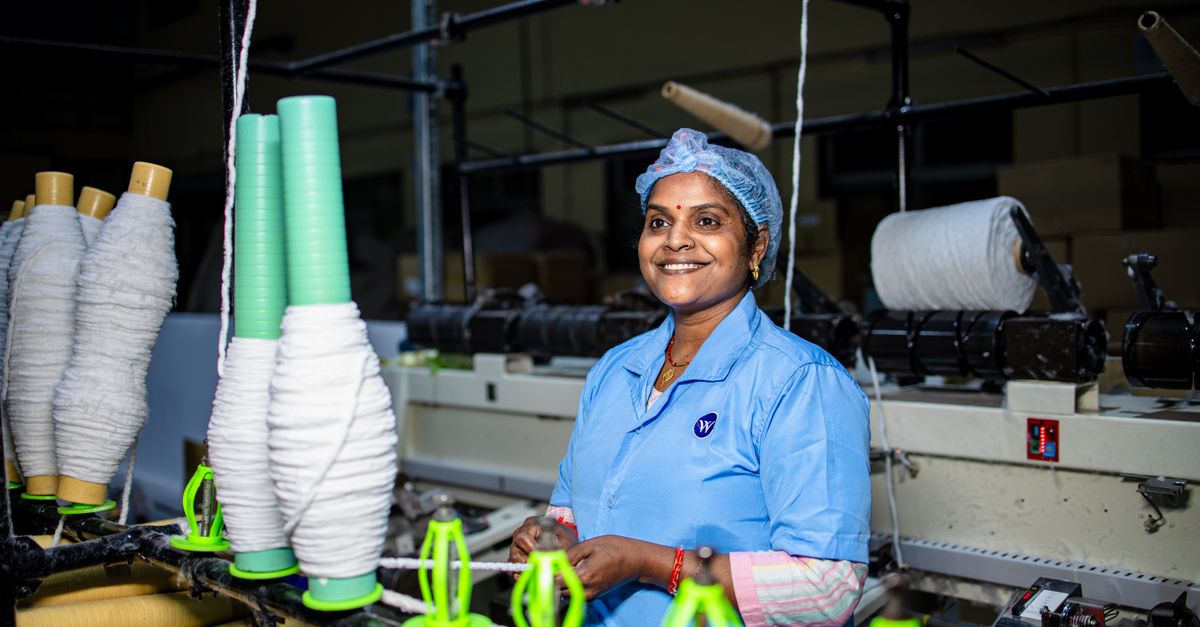 Indian Female Textile Worker in Factory Setting · Free Stock Photo