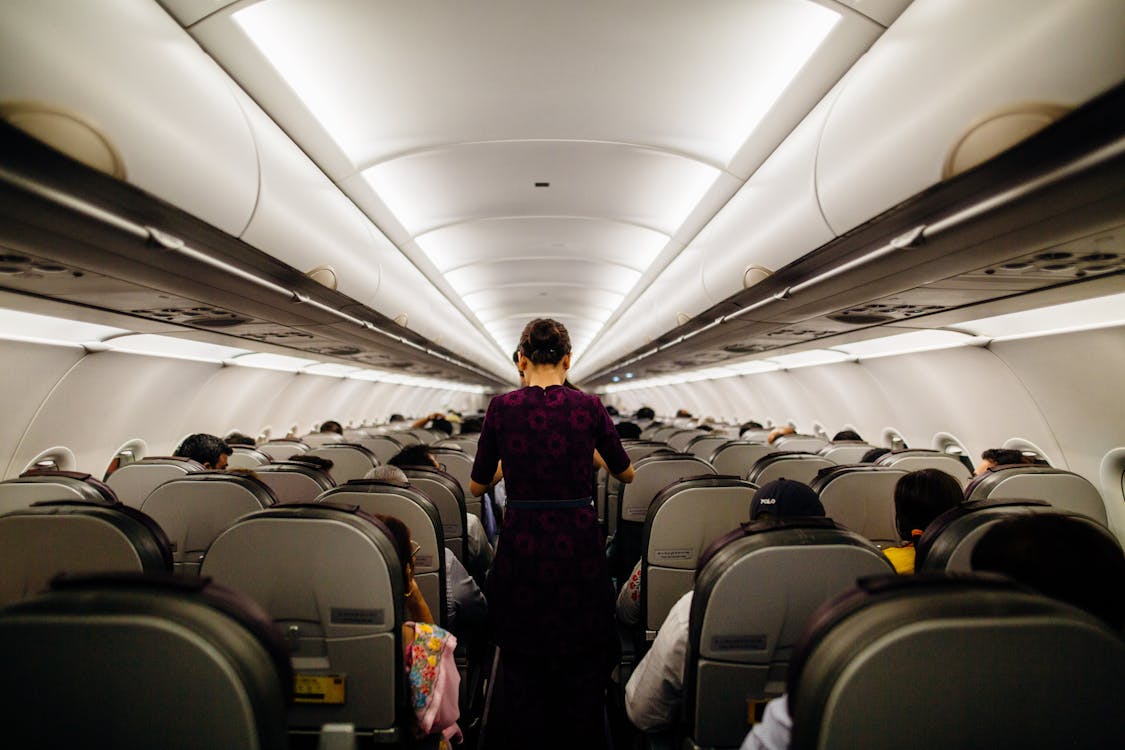 Free Person Standing Inside Airliner Stock Photo