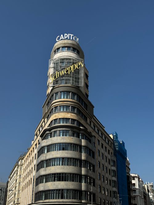 Free Iconic Capitol Building with Schweppes sign on Gran Via, Madrid, Spain. Stock Photo