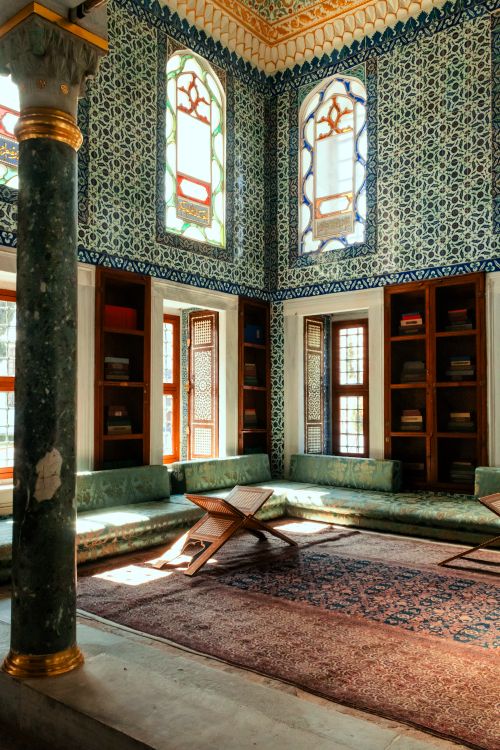 Free Elegant Ottoman-style room in İstanbul with stained glass windows and intricate tile design. Stock Photo