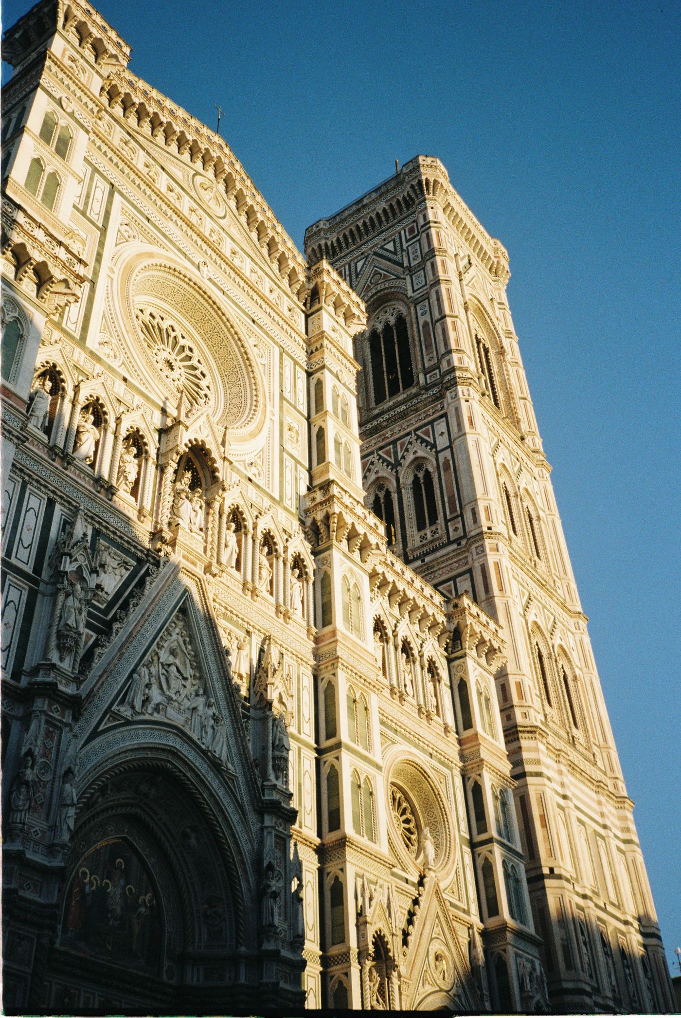 The facade of Florence Cathedral lit by sun