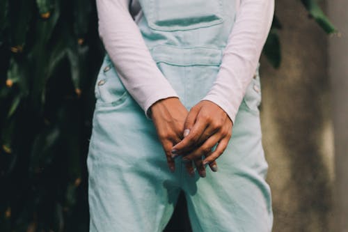 Person Wearing Long-sleeved Shirt and Teal Pants