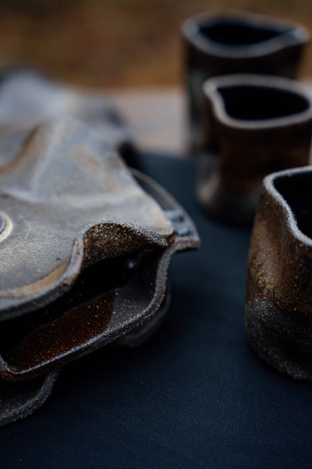 Close-up of handmade pottery with a rustic finish — photo by Galina Lasaeva on Pexels