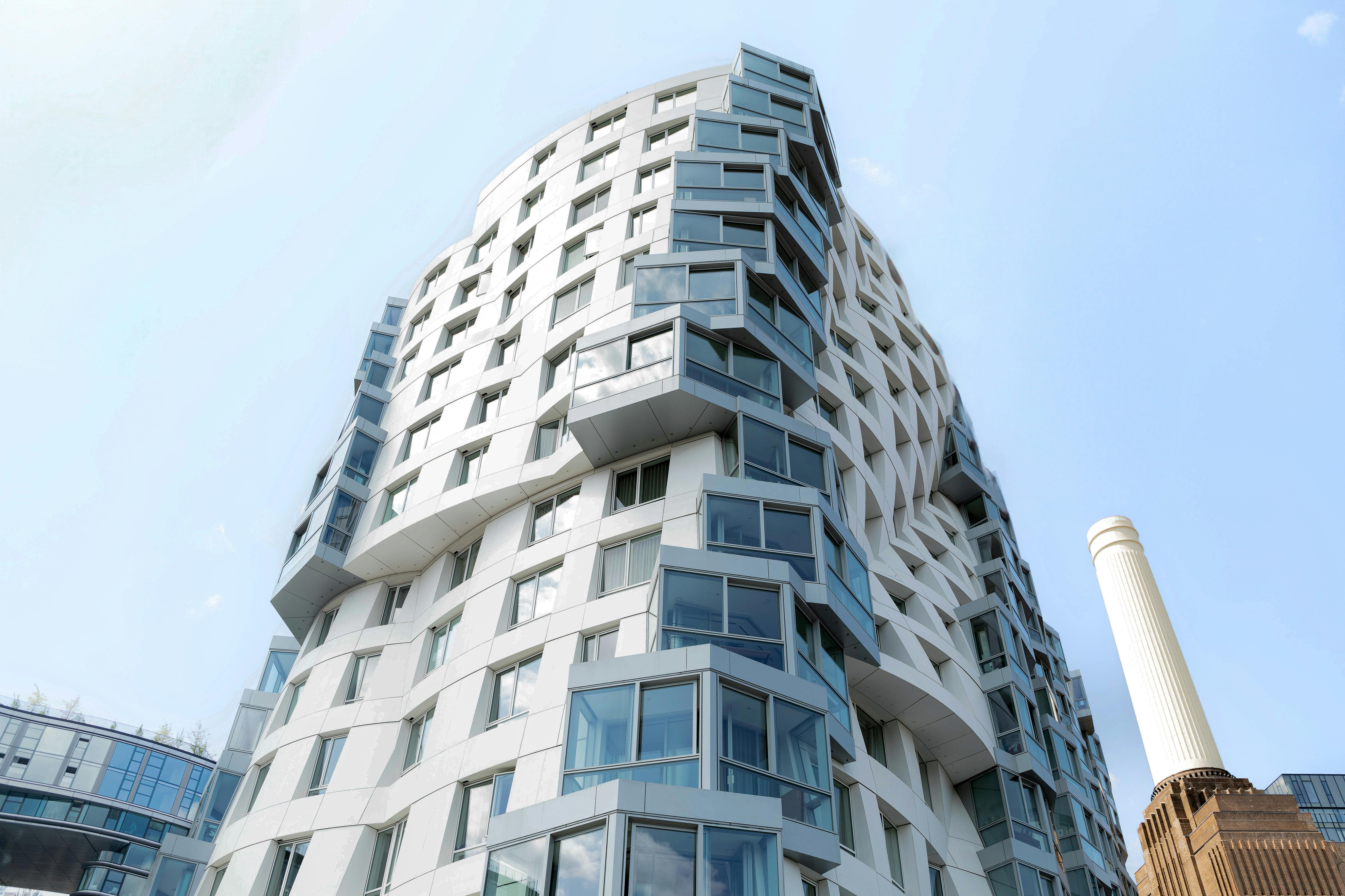 Striking modern architecture of a building in London with clear blue sky.