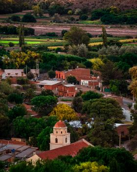 Beautiful northern Argentinian village landscape with church and lush greenery.