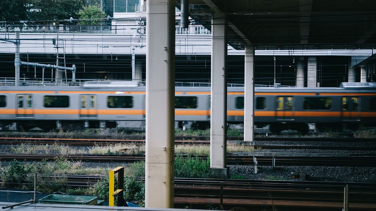 Train arriving at a Japanese station platform where IC cards are accepted