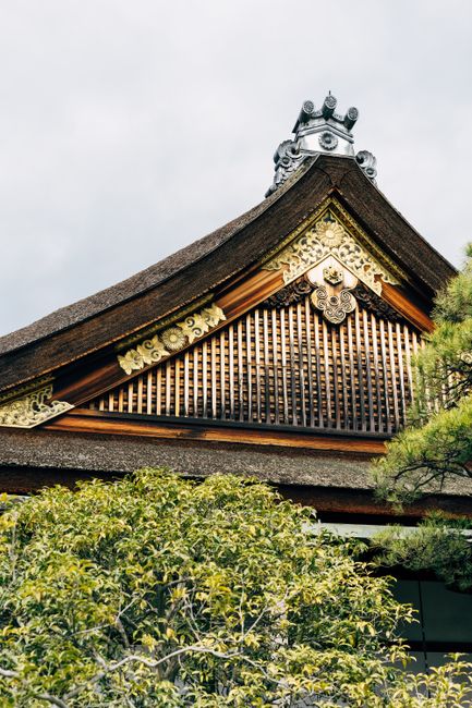 Close-up of ornate traditional Japanese temple roof in Kyoto, Japan.
