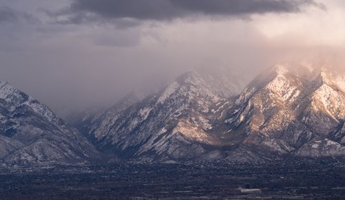 Free Capture of snow-covered Wasatch Mountains during a dramatic sunset. Stock Photo