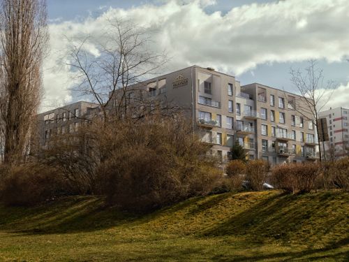 Free Contemporary apartment complex amidst landscaped greenery in Zielona Góra, Poland. Stock Photo