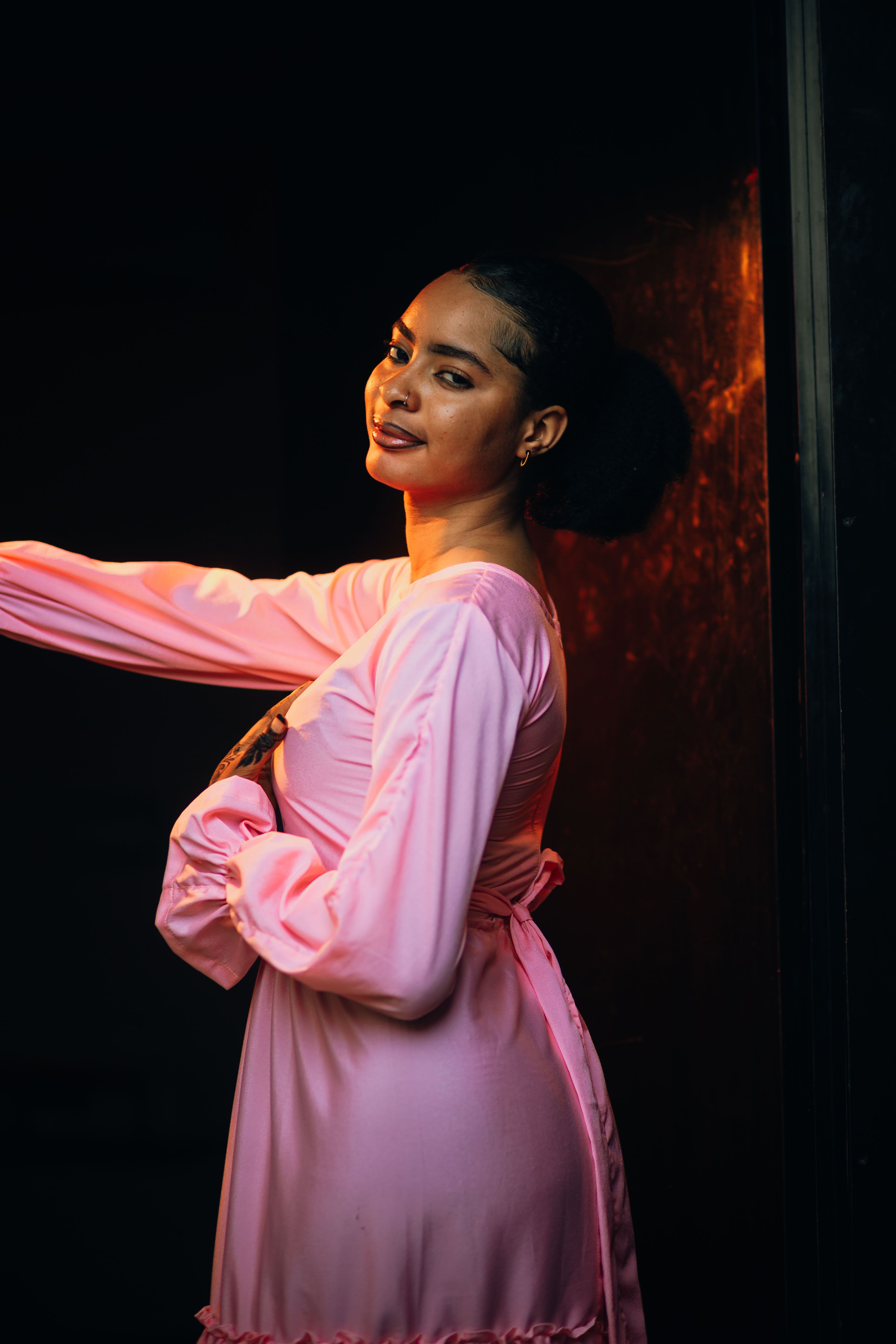 Stylish Woman in Pink Dress Posing Indoors · Free Stock Photo