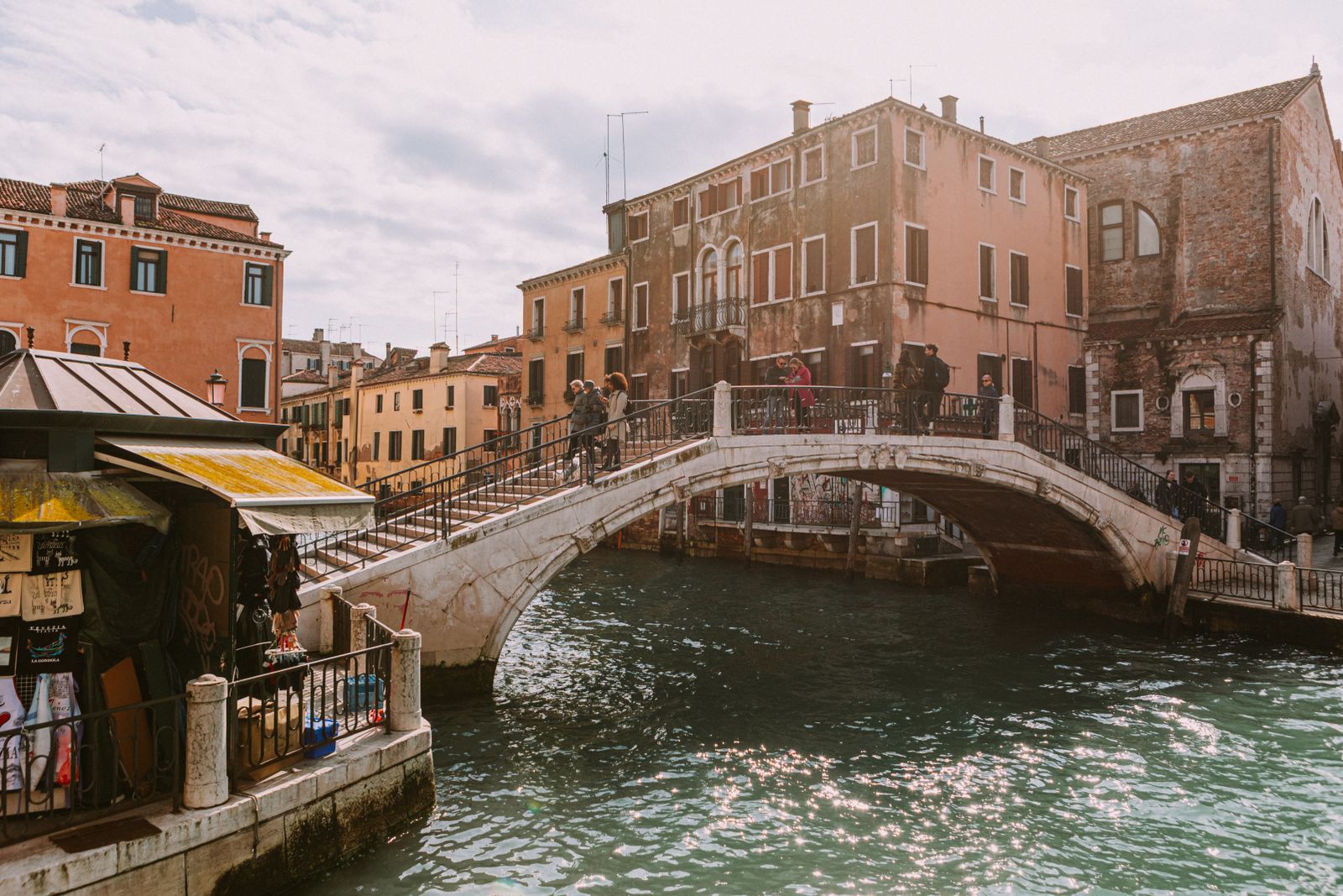 A Venetian canal with a historic pedestrian bridge