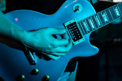 Free Electric guitar being played in a live music setting at a venue in Winston-Salem. Stock Photo
